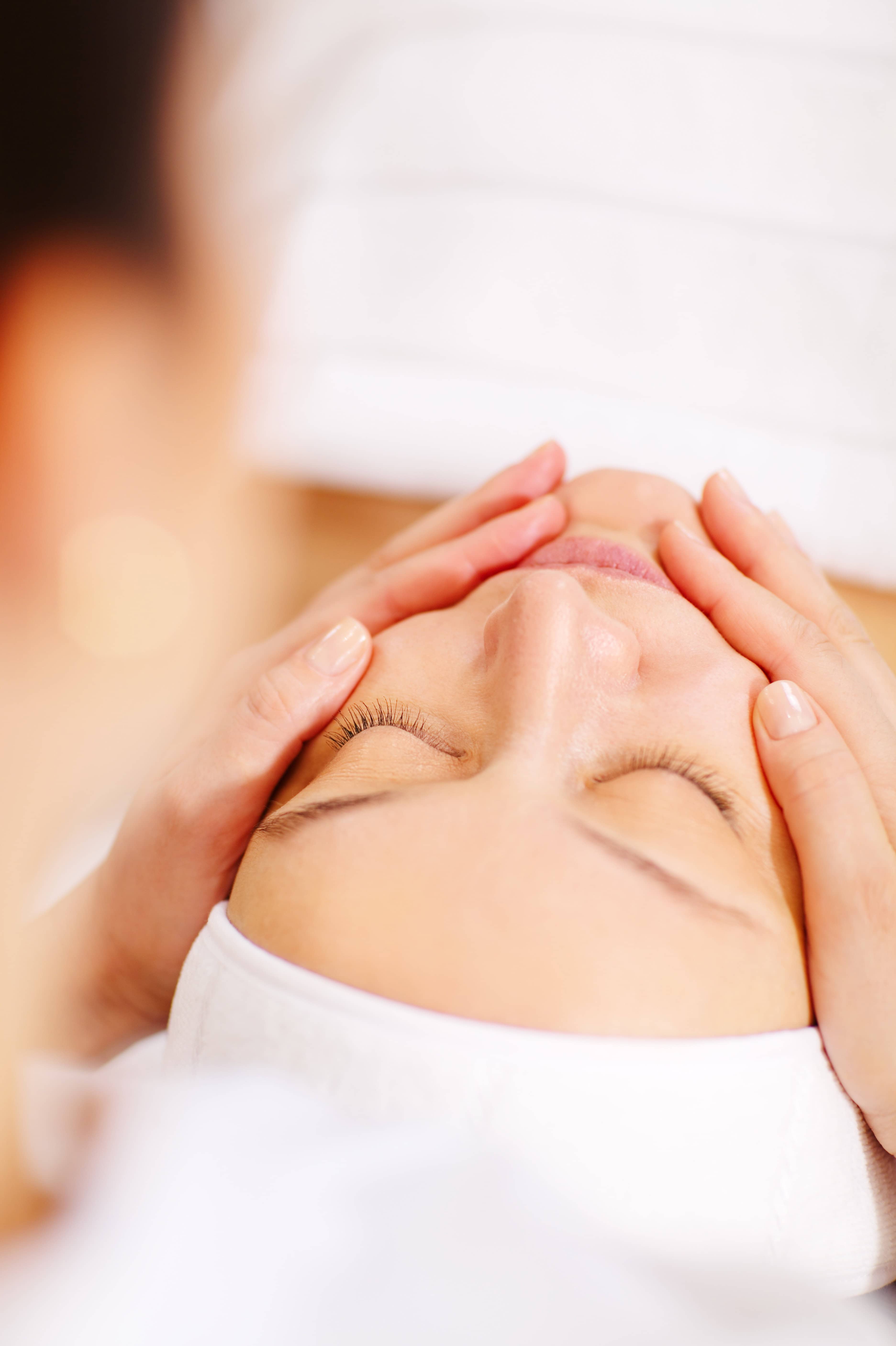 Woman under facial spa procedure