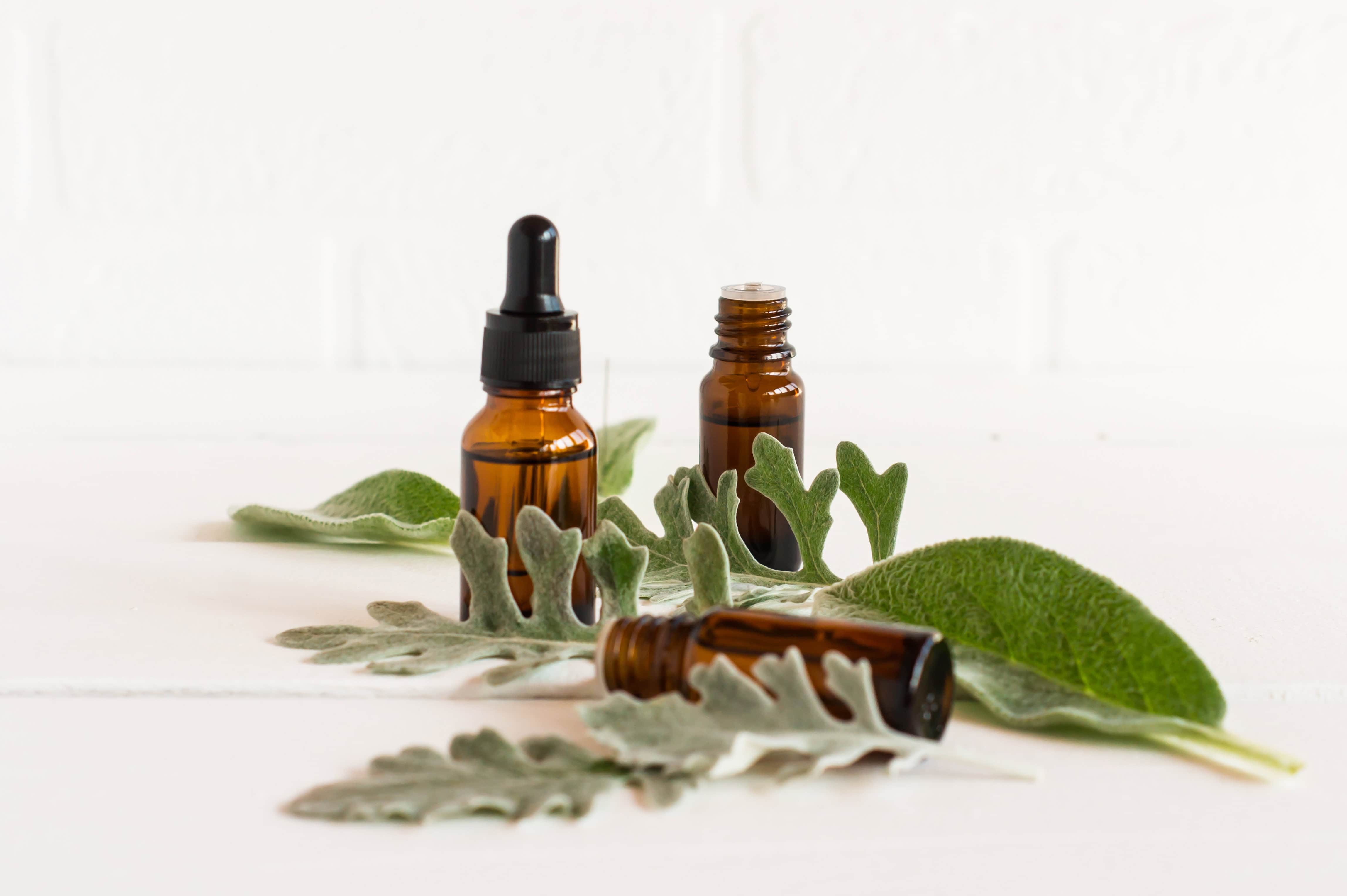 the concept of a natural organic essential oil . two bottles with a cosmetic natural remedy against