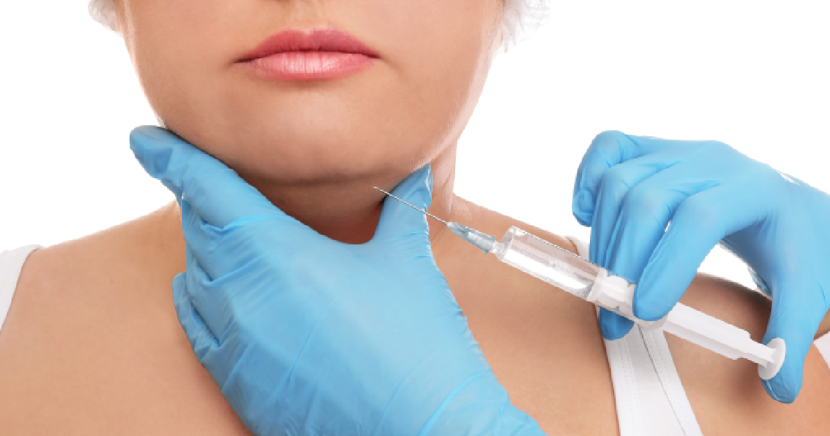 Close-up of a medical professional wearing blue gloves injecting Kybella into the area under a patient's chin to reduce double chin fat in Scottsdale, AZ