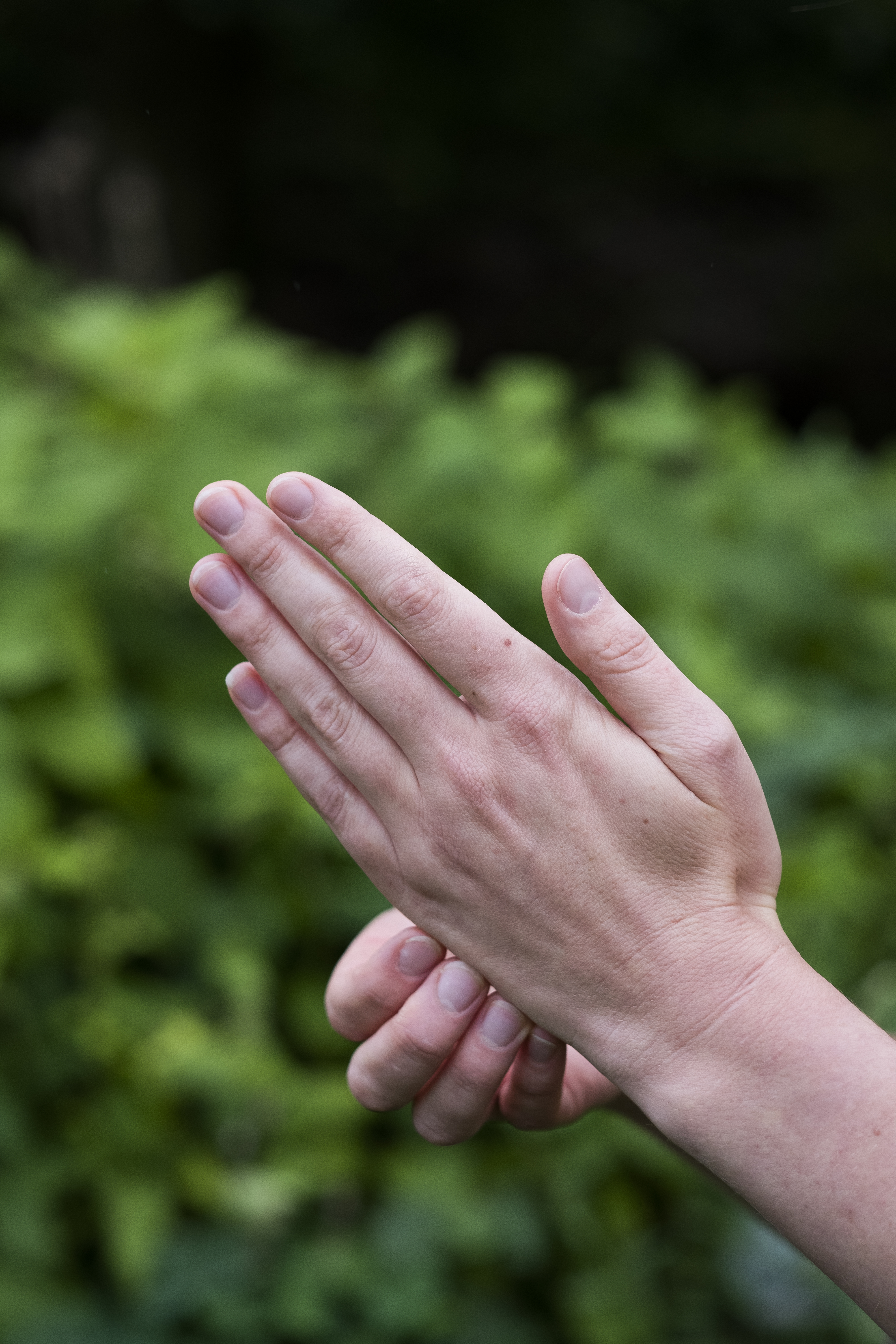Close up of a woman's hands, pressing meridian points on the hands, therapy